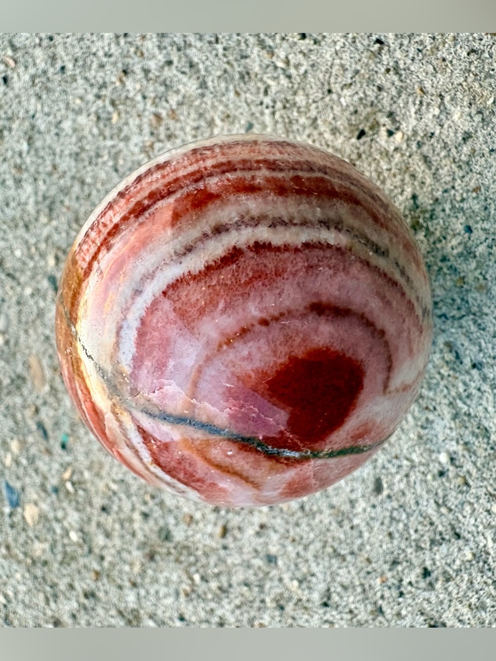Polished Red and Pink Onyx Sphere